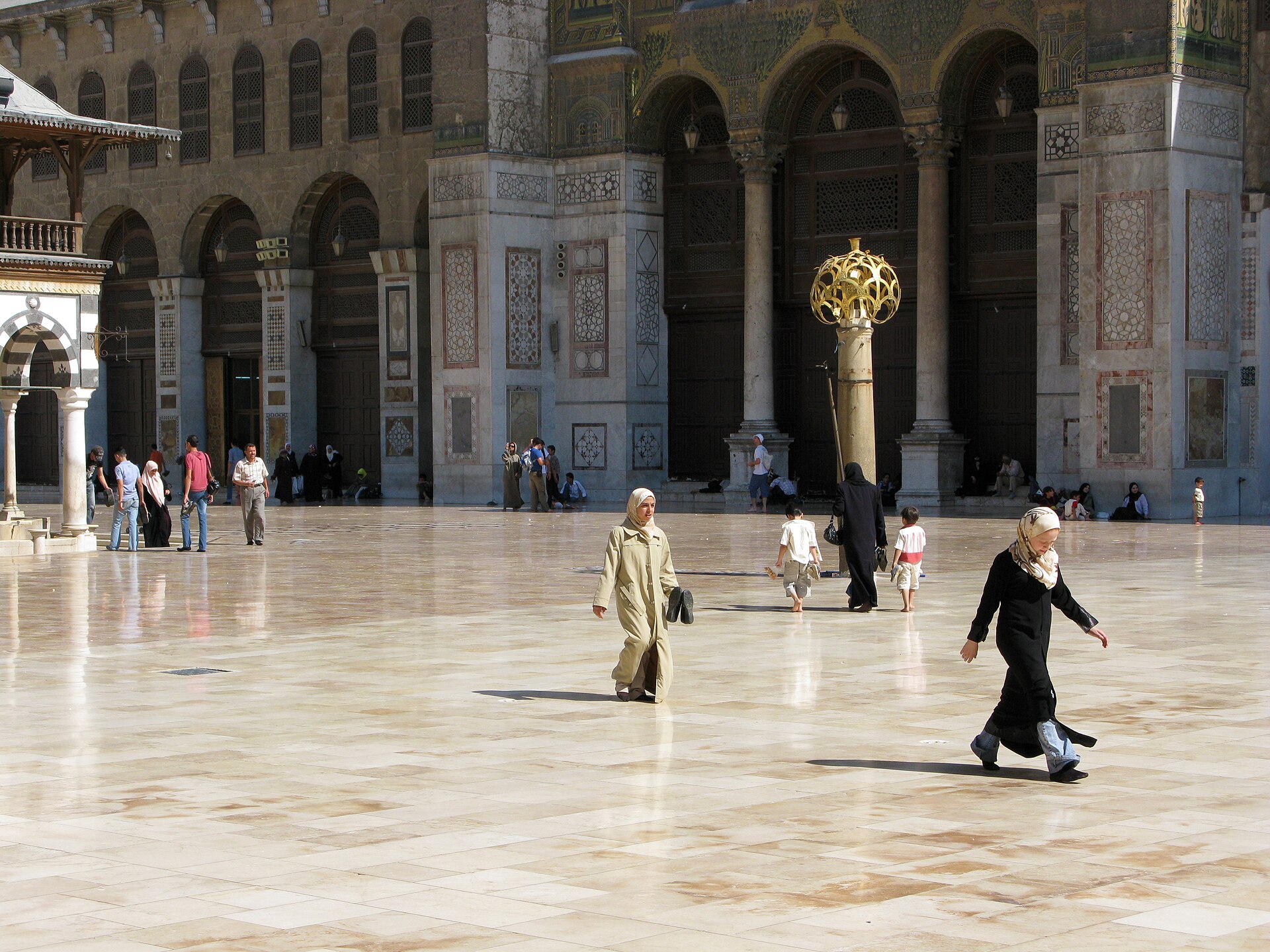 The vast marble courtyard of the Umayyad Mosque in Damascus, built in 705 CE