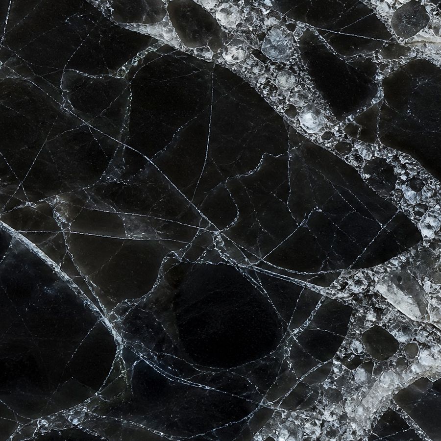 Portoro Ice — velvety black ground traced with silver-white veins